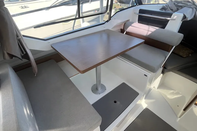 Slide: The Image of Interior of 2020 Jeanneau NC 795 boat with dining area and seating. - 34