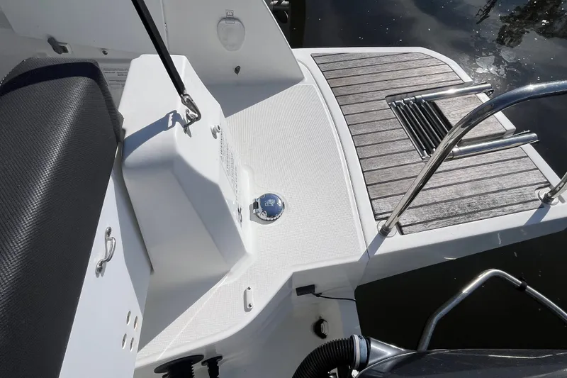 Slide: The Image of 2020 Jeanneau NC 795 boat deck with seating and swim platform. - 12