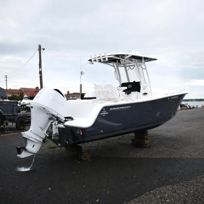 The Image of 2023 Sportsman Open 242 Center Console boat with Yamaha engine on display. - 0
