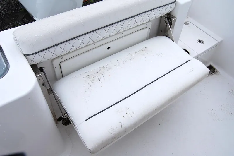 Slide: The Image of 2023 Sportsman Open 242 Center Console boat seat with white upholstery and diamond pattern. - 13