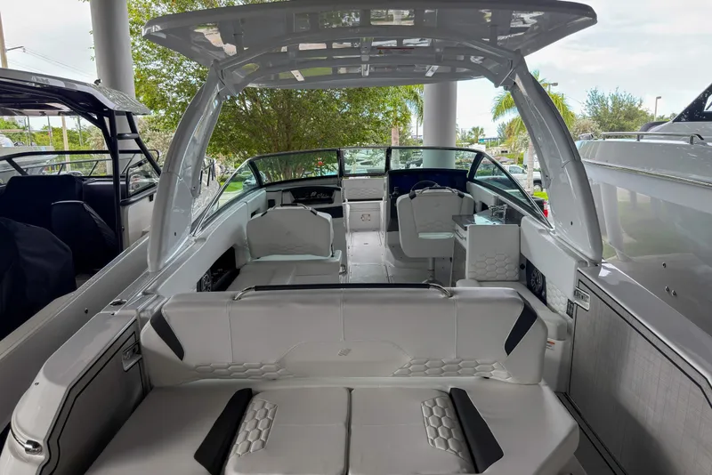 Slide: The Image of 2026 Four Winns H9 OB boat interior with modern seating and sleek design. - 4