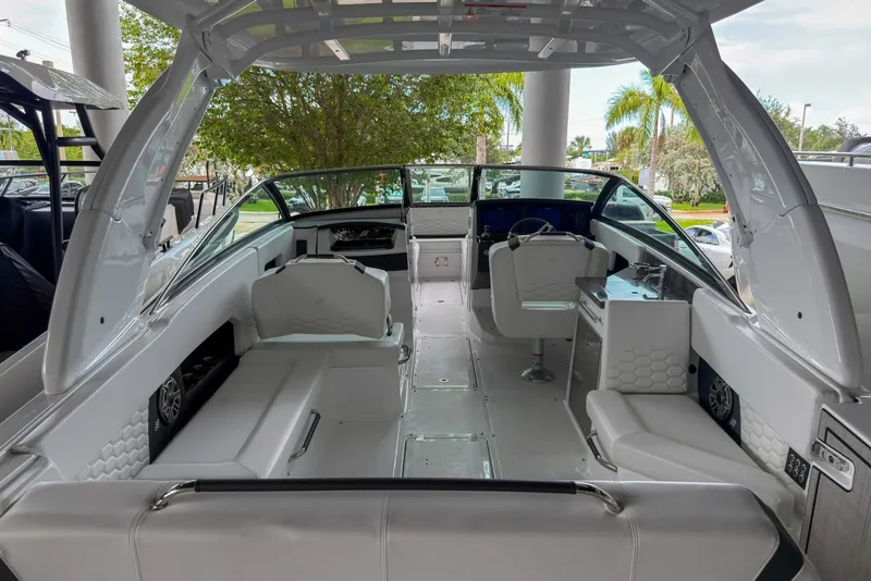 Slide: The Image of Interior view of 2026 Four Winns H9 OB boat, featuring sleek seating and modern design. - 3