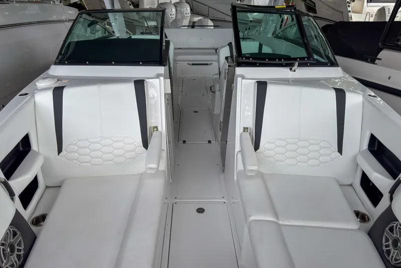 Slide: The Image of 2026 Four Winns H9 OB boat interior with white seating and modern design. - 22