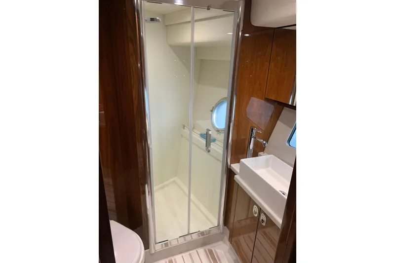 Slide: The Image of Luxurious bathroom in 2016 Sunseeker Manhattan 65 yacht with modern shower and sink. - 23