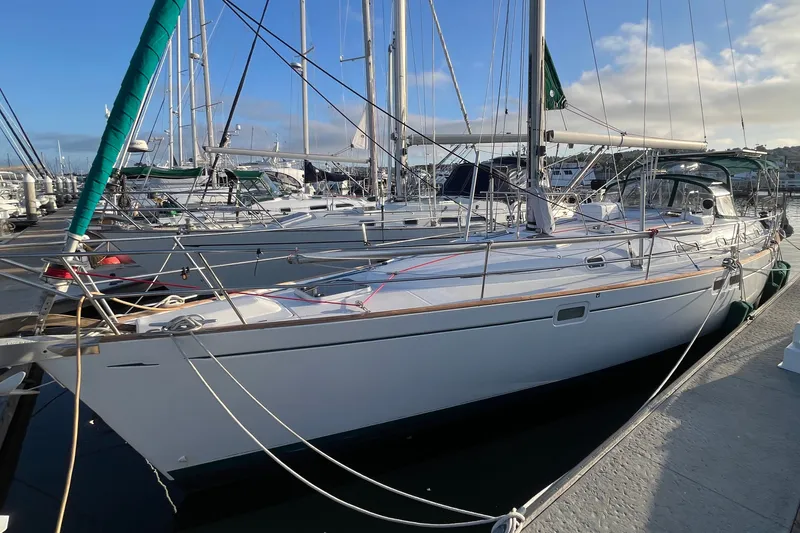 Slide: The Image of 2001 Beneteau Oceanis 461 sailboat docked at marina under clear sky. - 59