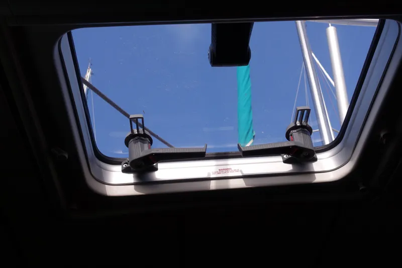 Slide: The Image of Hatch view from 2001 Beneteau Oceanis 461 sailboat, showing mast and blue sky. - 24
