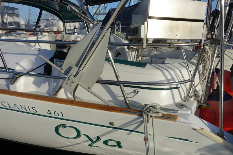 Slide: The Image of 2001 Beneteau Oceanis 461 sailboat with anchor and deck details in marina setting. - 55