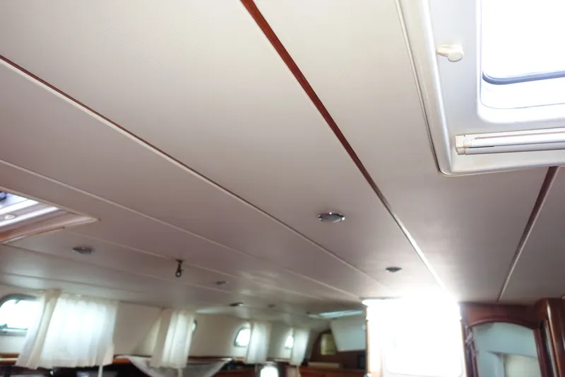 Slide: The Image of Interior ceiling of 2001 Beneteau Oceanis 461 yacht, featuring sleek design and natural light. - 34