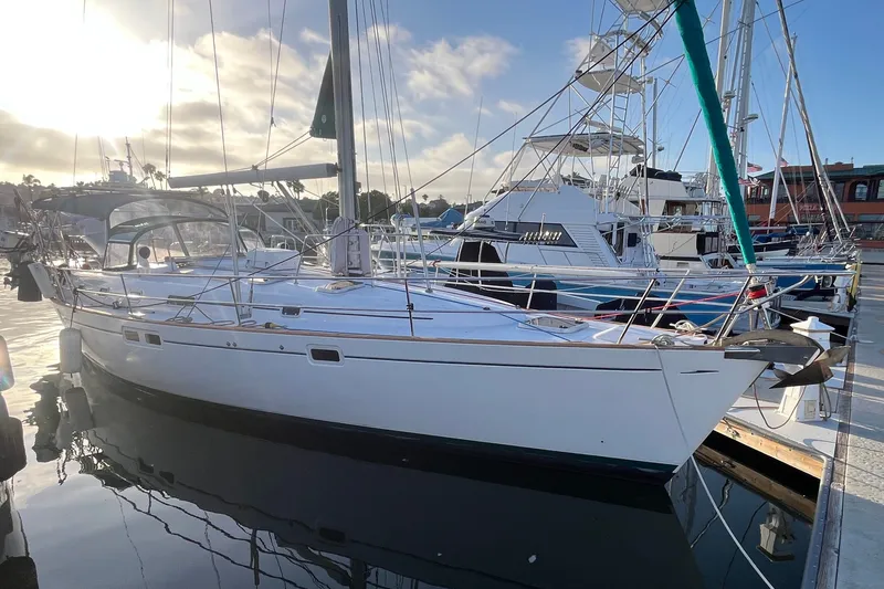 Slide: The Image of 2001 Beneteau Oceanis 461 sailboat docked at marina under a clear sky. - 61