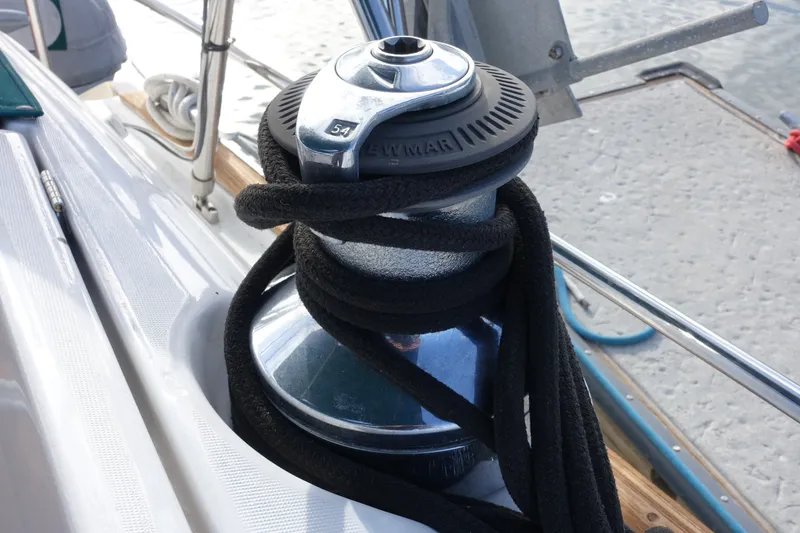 Slide: The Image of Winch on 2001 Beneteau Oceanis 461 sailboat, wrapped with black rope. - 19