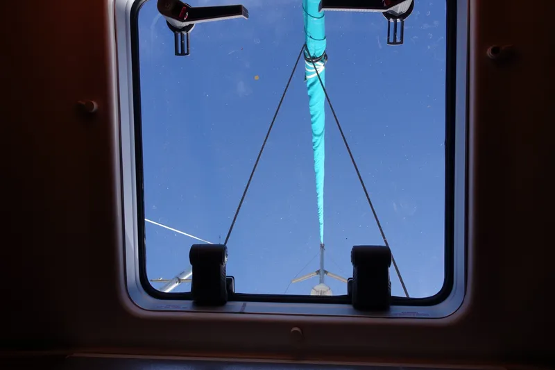 Slide: The Image of View through hatch of 2001 Beneteau Oceanis 461 sailboat, showing mast and blue sky. - 26