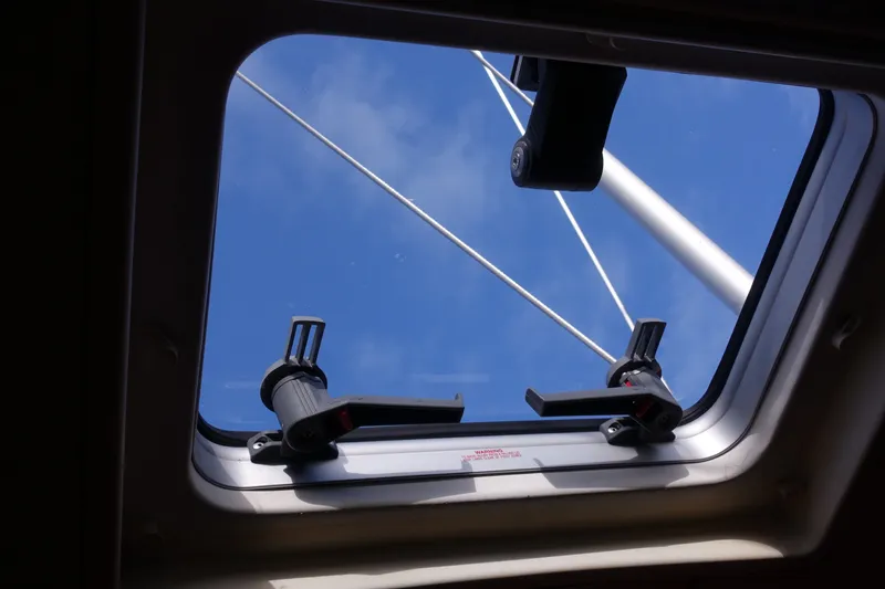 Slide: The Image of Hatch view from 2001 Beneteau Oceanis 461 sailboat, showing mast and blue sky. - 23