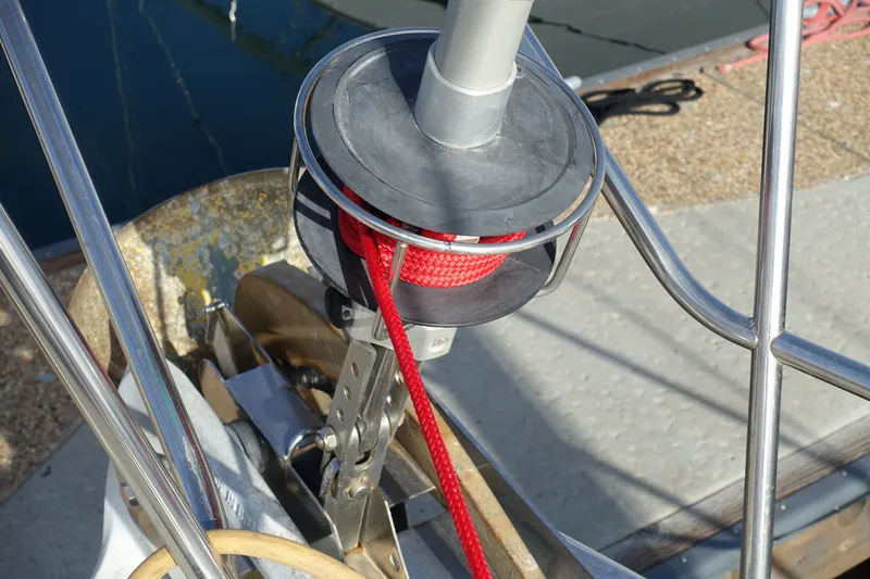 Slide: The Image of Close-up of a Beneteau Oceanis 461 sailboat's anchor windlass with red rope, 2001 model. - 17