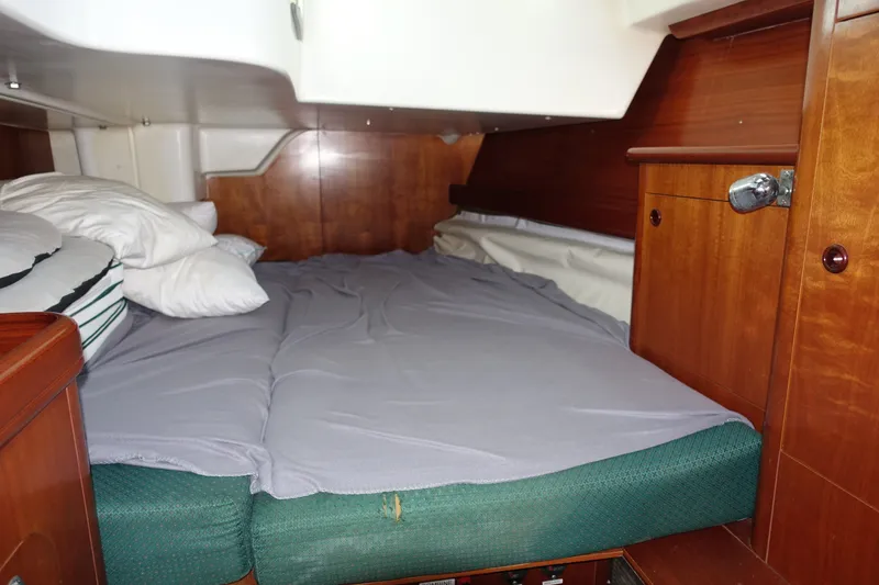Slide: The Image of Cozy cabin interior of 2001 Beneteau Oceanis 461 sailboat with comfortable bedding. - 39