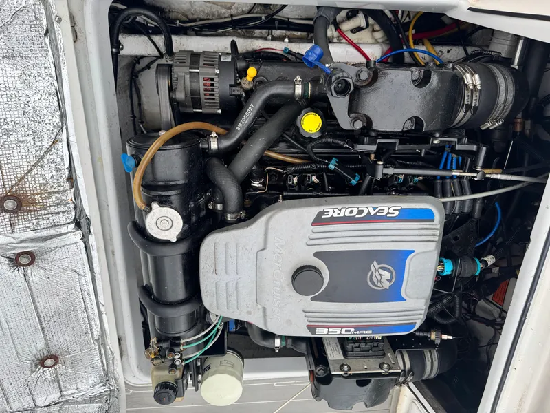 Slide: The Image of Engine compartment of a 2005 Topaz 24 with a 350 MAG Seacore engine. - 17