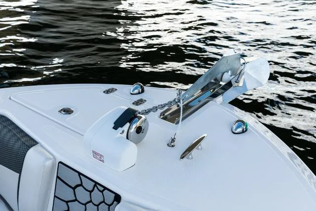 Slide: The Image of 2023 Wellcraft 222F boat anchor detail on water. - 13
