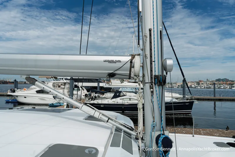 Slide: The Image of 2019 Nautitech 40 Open catamaran docked at marina with clear blue sky. - 19