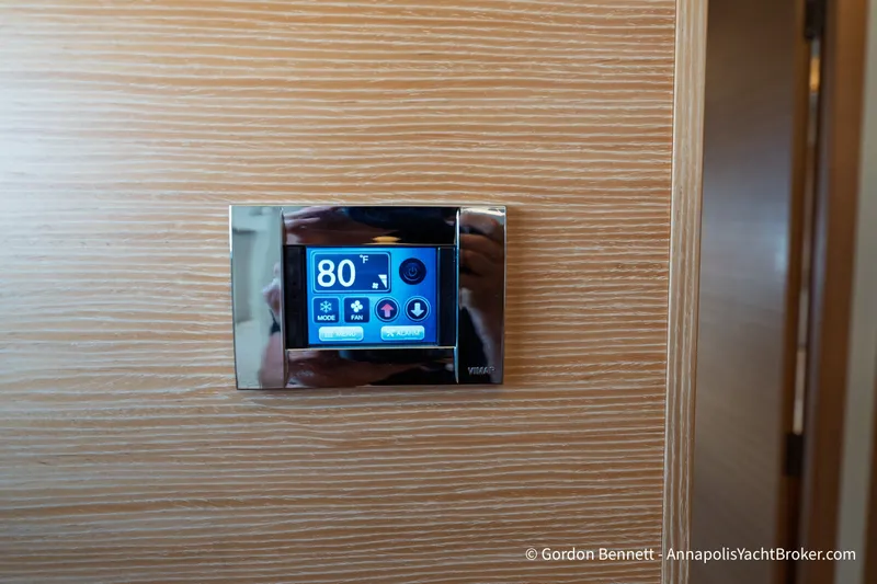 Slide: The Image of Digital thermostat on 2019 Nautitech 40 Open yacht, displaying 80°F on wooden panel. - 61