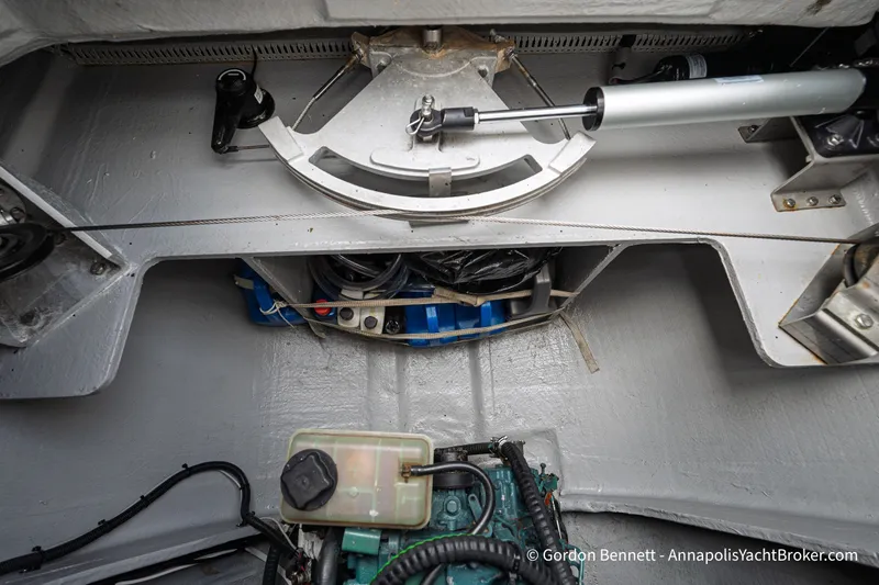 Slide: The Image of Engine compartment of 2019 Nautitech 40 Open catamaran, showcasing mechanical components and steering system. - 81