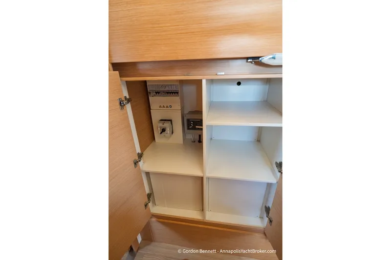 Slide: The Image of Interior cabinet of 2019 Nautitech 40 Open yacht, showcasing storage and electrical panel. - 60