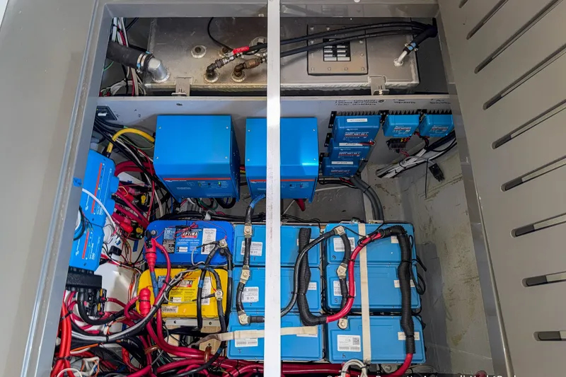 Slide: The Image of Electrical system of a 2019 Nautitech 40 Open catamaran, featuring batteries and wiring. - 76