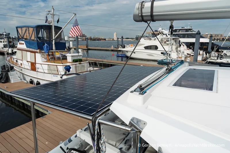 Slide: The Image of 2019 Nautitech 40 Open catamaran with solar panels docked at a marina. - 24