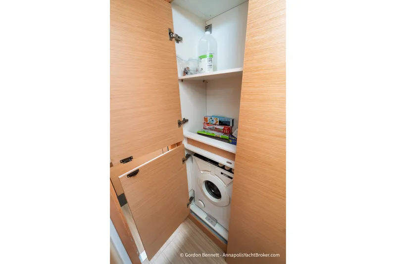 Slide: The Image of Laundry area with washing machine in 2019 Nautitech 40 Open yacht cabinet. - 57