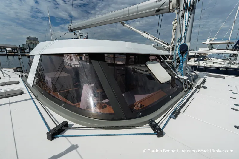 Slide: The Image of 2019 Nautitech 40 Open catamaran docked, showcasing sleek design and spacious deck. - 16