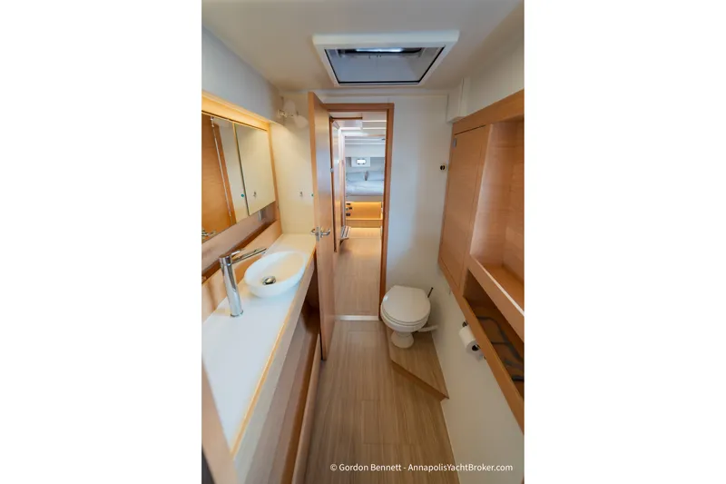 Slide: The Image of Modern bathroom interior of 2019 Nautitech 40 Open yacht, featuring sleek design and wood accents. - 48
