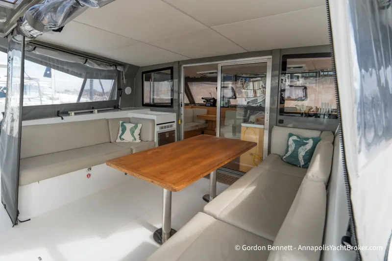 Slide: The Image of Interior of 2019 Nautitech 40 Open catamaran with spacious seating and wooden table. - 36