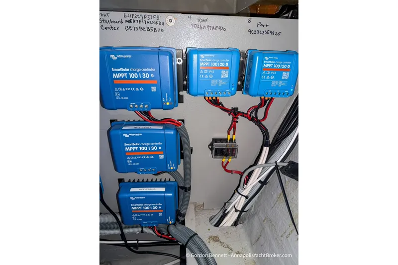 Slide: The Image of Electrical setup with Victron Energy SmartSolar charge controllers on a 2019 Nautitech 40 Open. - 79