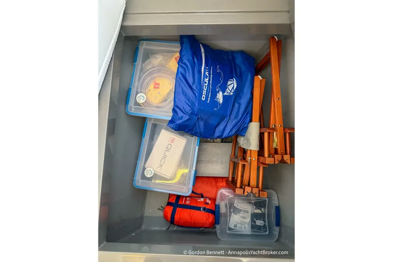 Slide: The Image of Storage compartment on a 2019 Nautitech 40 Open with safety gear and equipment. - 70