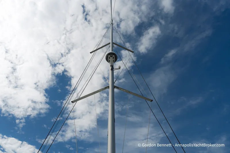 Slide: The Image of Mast of 2019 Nautitech 40 Open catamaran against a partly cloudy sky. - 20