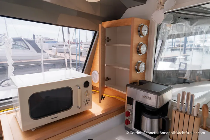 Slide: The Image of Interior of 2019 Nautitech 40 Open yacht with microwave, coffee maker, and knife set. - 42