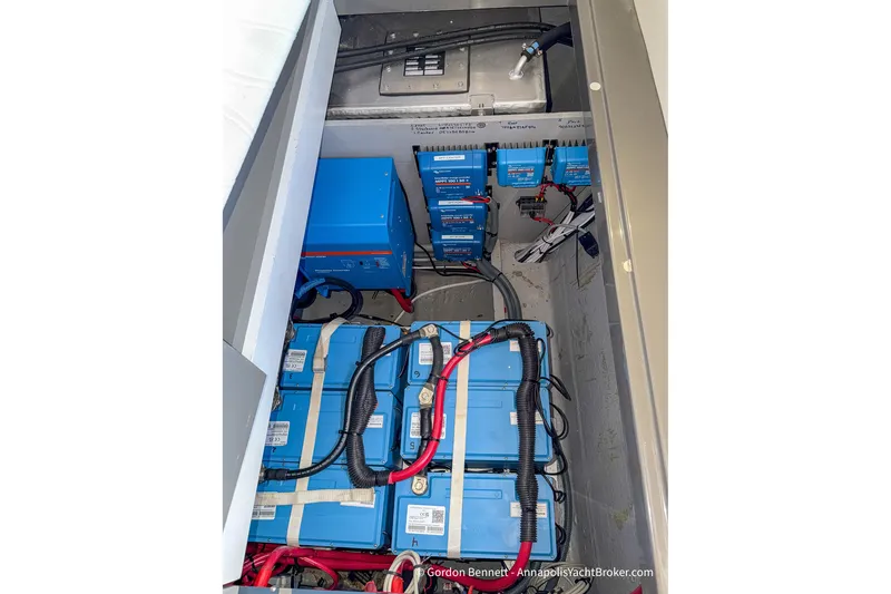 Slide: The Image of Electrical system of a 2019 Nautitech 40 Open catamaran, featuring batteries and wiring. - 77