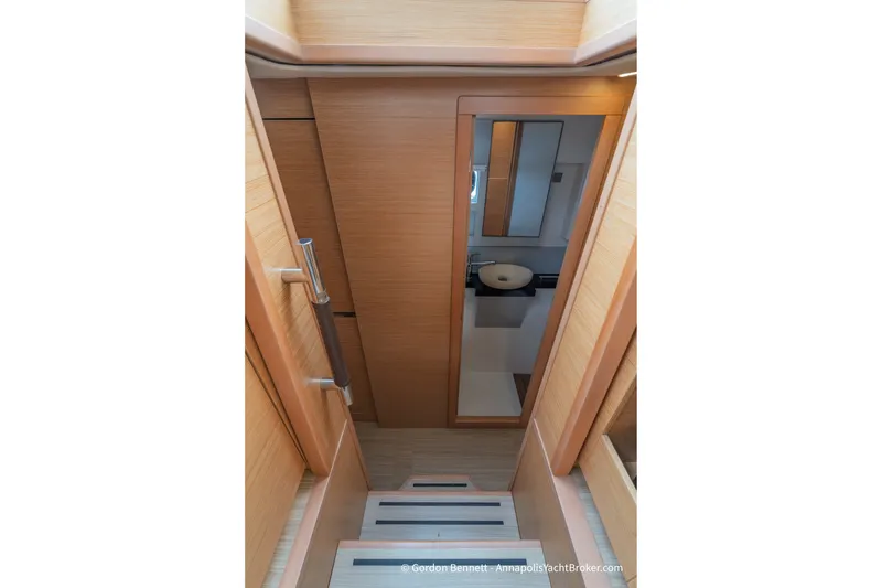 Slide: The Image of Interior view of 2019 Nautitech 40 Open yacht, featuring wooden stairs and modern bathroom. - 51
