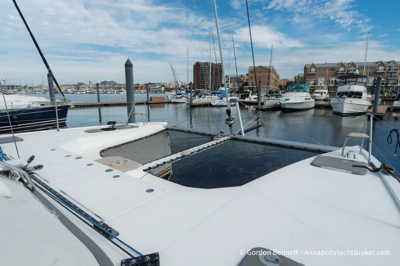 Slide: The Image of 2019 Nautitech 40 Open catamaran docked at a marina with other boats. - 13