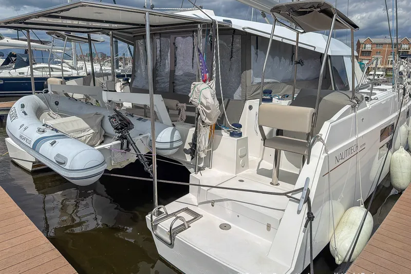 Slide: The Image of 2019 Nautitech 40 Open catamaran docked with inflatable dinghy attached. - 31