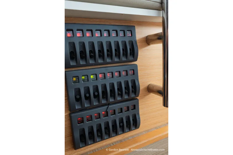 Slide: The Image of Control panel on a 2019 Nautitech 40 Open yacht with multiple switches. - 73
