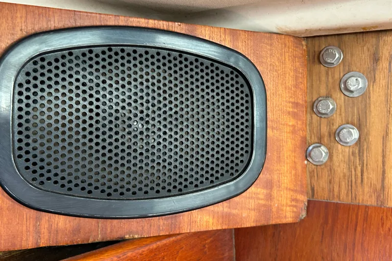 Slide: The Image of Speaker and bolts on wooden panel of 1976 Sabre 28 boat interior. - 49