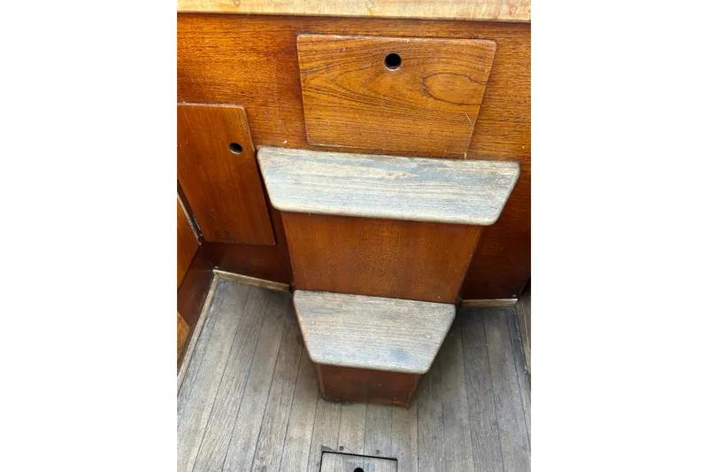 Slide: The Image of Wooden interior steps of a 1976 Sabre 28 sailboat. - 33