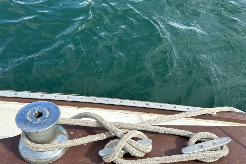 Slide: The Image of Deck view of 1976 Sabre 28 sailboat with winch and cleat, overlooking water. - 20