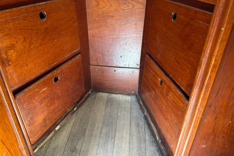 Slide: The Image of Wooden interior drawers of a 1976 Sabre 28 sailboat. - 42