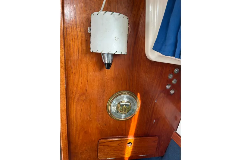 Slide: The Image of Wooden interior of a 1976 Sabre 28 sailboat with nautical instruments. - 46