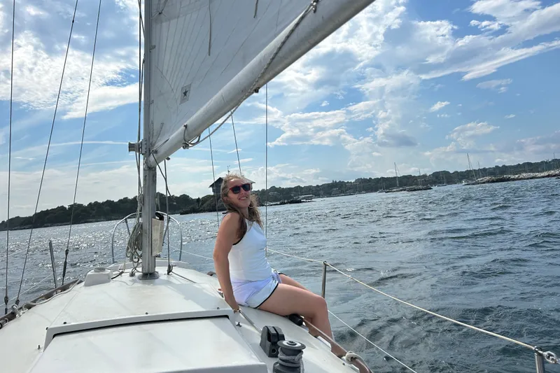 Slide: The Image of Woman enjoying a sunny day on a 1976 Sabre 28 sailboat. - 22