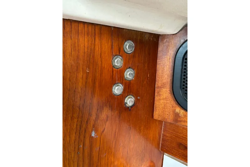 Slide: The Image of Wooden interior detail with bolts on a 1976 Sabre 28 sailboat. - 48
