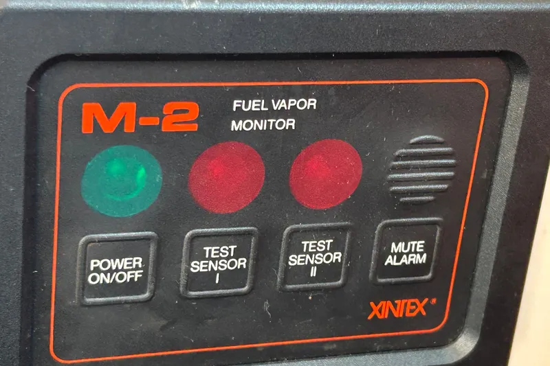 Slide: The Image of M-2 fuel vapor monitor panel with buttons and indicators on a 1976 Sabre 28. - 54