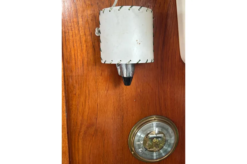 Slide: The Image of Vintage Sabre 28 boat interior with a wall-mounted light and barometer, 1976 model. - 45