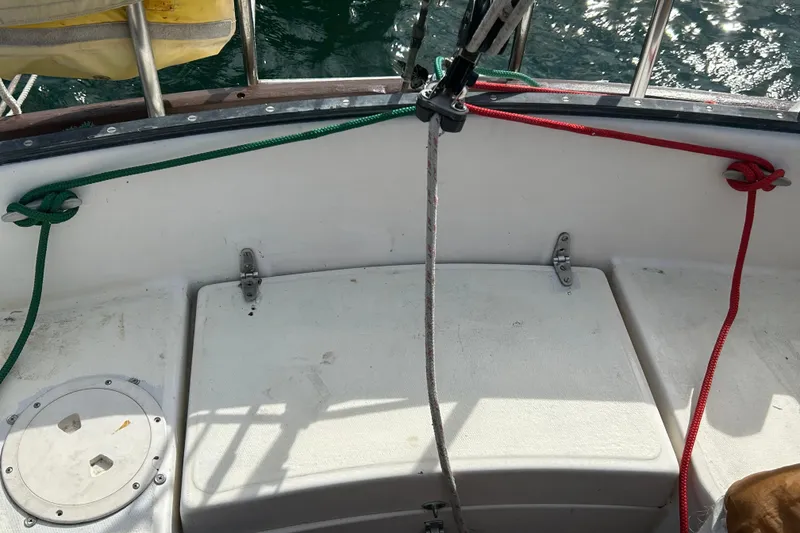 Slide: The Image of Cockpit of a 1976 Sabre 28 sailboat with ropes and hatch. - 18