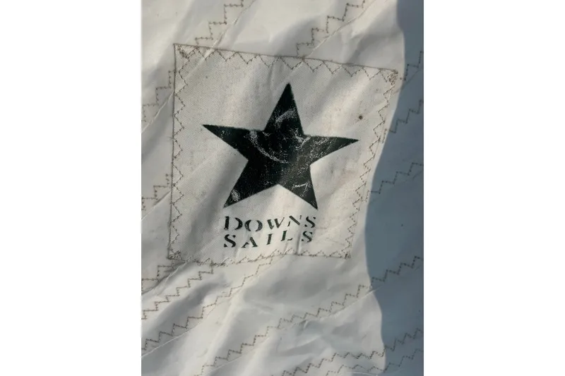 Slide: The Image of Close-up of a 1976 Sabre 28 sail with Downs Sails logo. - 13